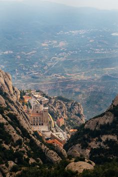 a view of the mountains and buildings from above