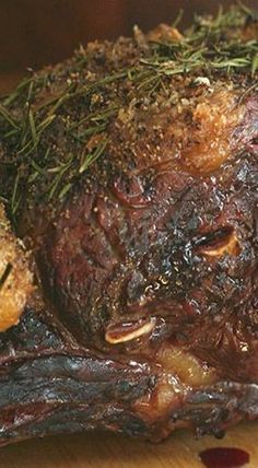 a piece of meat sitting on top of a wooden cutting board