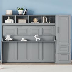 a gray bookcase with two shelves and a white cat figurine on top