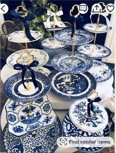 blue and white plates with gold handles are on display