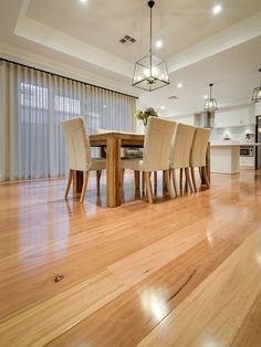 a dining room table with six chairs in it