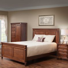 a bedroom scene with focus on the bed and dresser