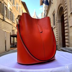 "This bag has been made of the best genuine leather by local master crafters of Florence in Italy, designed for women who only accept premium Italian quality and luxury leather bags and modern Italian fashion. . Size: Width: 27 cm / 10.75 inches Height: 19 cm / 7.50 inches Depth: 9 cm / 3.50 inches . The story of this bag : Once upon a time, in the charming city of Florence, Italy, renowned for its exquisite artistry and craftsmanship, there existed a small workshop tucked away in a cobblestone alley. This was the home of a gifted artisan named Alessio, whose passion for creating beauty out of leather was unparalleled. Alessio specialized in handcrafted leather goods, and his most prized creations were the leather clutch bags that exuded elegance and sophistication. The timeless charm of h High-end Everyday Bucket Shoulder Bag, Everyday High-end Bucket Shoulder Bag, High-end Daily Use Bucket Bag With Removable Pouch, High-end Bucket Bag With Removable Pouch For Daily Use, High-end Everyday Pouch Bucket Bag, Luxury Daily Use Bucket-shaped Bag, Luxury Bucket-shaped Bags For Daily Use, High-end Everyday Leather Bucket Bag, Leather Bucket Bag With Smooth Grain For Office