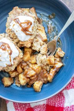 a blue plate topped with apple cobbler and ice cream