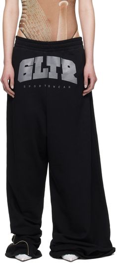 Wide-leg French terry sweatpants. · Concealed drawstring at elasticized waistband · Two-pocket styling · Text printed at front · Zip expansion panel at extended cuffs · Locker loop at back Part of the Jean Paul Gaultier x Shayne Oliver collaboration. Supplier color: Black Shayne Oliver, Buy Jeans, Sleepwear & Loungewear, Paul Gaultier, Jean Paul, Jean Paul Gaultier, Lounge Pants, Active Wear For Women, French Terry