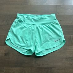 Nike Running Shorts Size Small 2 Internal Pockets Zip Pocket Adjustable Straps Never Worn Green Stretch Nike Bottoms, Nike Green Athletic Shorts For Spring, Nike Green Short Length Bottoms, Nike Green Shorts For Spring, Nike Green Short Bottoms, Nike Green Sporty Athletic Shorts, Green Nike Shorts For The Beach, Nike Green Athletic Running Shorts, Compressive Nike Athletic Shorts