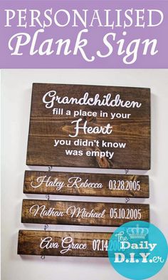 some wooden signs are hanging on the wall in front of a white background and purple lettering