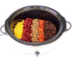 an image of beans and rice in the crock pot on the stove or oven