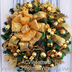 a christmas wreath with gold and green decorations