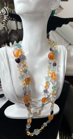 Lovely very long beaded colorful multi fluorite necklace. Faceted fluorite beads in heart, flower, oval and round shapes, in brass , blue, green, yellow, purple and turquoise colors. Colors to wear all seasons. 50 cm long, can worn twice around neck. No clasp! Luxury Long Multicolor Beaded Necklace, Luxury Multicolor Long Beaded Necklace, Multicolor Glass Long Necklace, Luxury Multi-strand Colorful Beaded Necklaces, Multicolor Multi-strand Crystal Necklace With Colorful Beads, Fluorite Jewelry, Fluorite Necklace, Heart Flower, Gold Rope Chains