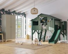 a child's bedroom with a green bunk bed and slide in the middle of it