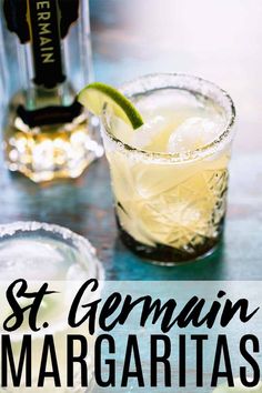 a close up of a drink on a table with the words st germain margaritas