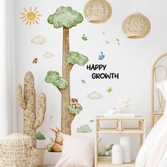 a child's bedroom with a happy growth wall decal on the wall and a cactus