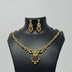 Description: Premium Quality  Gold Plated CZ necklace and matching earrings are lightweight and made with the highest quality craftsmanship. They are a stunning addition to any outfit and will make a perfect gift for any occasion. Features: Crystal stones Lightweight and elegant Can be paired with any dress, kurti, or saree DESIGN: we have 4 different necklace sets in this Listing 1. Gold Dangle Set 2.Flower Pearl Drop 3.All Flowers 🌸 1 4. All Flowers 🌸 2 Material: Cubic Zirconia (CZ) Stones P Elegant Gold Plated Filigree Jewelry Sets, Elegant Gold-plated Filigree Jewelry Sets, Elegant Filigree Jewelry Sets For Celebration, Elegant Filigree Jewelry Sets, Gold Diamond Bridal Necklace With Matching Earrings, Formal Gold Plated Filigree Jewelry Sets, Gold Plated Necklaces With Matching Earrings For Anniversary, Gold Diamond Jewelry Sets With Earrings, Gold Diamond Jewelry Set With Matching Earrings