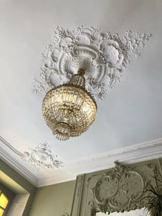 a chandelier hanging from the ceiling in a room