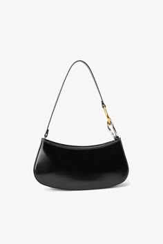 The Ollie Bag is a mini shoulder bag made out of polished leather. This style features a hardware design on the strap and a zip closure. Wishlist 2022, Custom Handbags, Novelty Bags, Christmas 2022, Crossbody Clutch, Fall 2022, Mini Shoulder Bag, Beaded Bags, Handbag Shoes