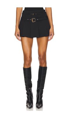 Find VERSACE Skirt on Editorialist. Versace Jeans Couture Skirt in Black. - size 36 (also in 38, 40, 42, 44, 46) Versace Jeans Couture Skirt in Black. - size 36 (also in 38, 40, 42, 44, 46) Self: 49% viscose 42% polyamide 9% elastane Lining: 100% polyester. Made in Italy. Hand wash. Unlined. Hidden side zipper closure. Adjustable buckled straps with gold-tone hardware. Pleated crepe fabric. Skirt measures approx 12.5 in length. VJEA-WQ9. E77HAE814_EN0394. Fitted Mini Skirt For Party, Chic High Waist Fitted Pleated Skirt, Fitted Party Skort With Short Inseam, Fitted Pleated Asymmetrical Mini Skirt, Fitted Asymmetrical Pleated Mini Skirt, Fitted Asymmetrical Tennis Skirt For Spring, Pleated Asymmetrical Fitted Mini Skirt, Elegant High Waist Fitted Tennis Skirt, Fitted Pleated Mini Skirt