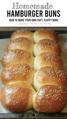 homemade hamburger buns in a baking pan with sesame seeds on top and text overlay that reads homemade hamburger buns how to make your own soft, fluffy buns