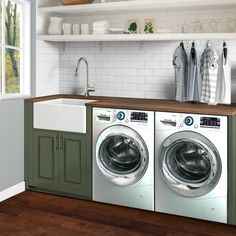 a washer and dryer sitting in a kitchen next to each other on top of a wooden counter