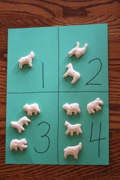 the numbers are made out of plastic animals