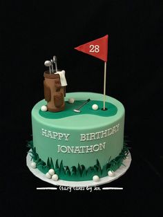 a birthday cake with a golf theme on the side and a flag in the middle