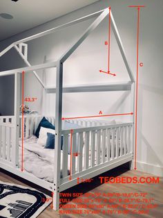 a white bed frame with measurements for the top bunk and bottom rails on each side