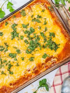 a casserole dish with cheese and herbs