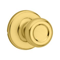 an image of two knobs on a door handle in polished brass finish, set against a white background