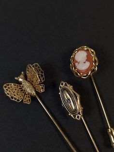 This set has 3 vintage stick pins made from a gold tone metal with other details. They measure about 2.25-2.75 inches long. One is marked Avon. They all have only very light wear with no flaws that I could find.  24-Jun-16 Stick Pins, Hat Pins, Gold Tone Metal, Brooch Pin, Brooches, Accessories Hats, Gold Tones, Accessory Gift, Electronic Accessories