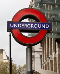 a red and blue sign that reads underground