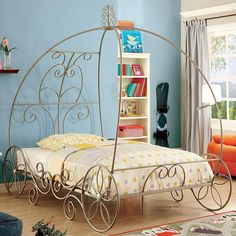 Enchant Twin Bed in Champagne. This beautiful coach design bed is filled with fun surprises! With its intricate, scrollwork pattern and its gorgeous color, our beautiful bed is more than worthy of a curtain call. Princess Transformation, Princess Carriage Bed, Unusual Beds, Carriage Bed, Twin Canopy Bed, Princess Canopy Bed, Princess Canopy, Metal Canopy Bed, Enchanted Princess