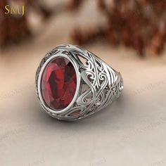 Elevate your style with our exquisite Garnet Men's Signet Handmade Ring, meticulously crafted from 925 sterling silver. This striking piece features an oval red garnet stone, adding a touch of sophistication and masculinity to any ensemble. Handcrafted with care and attention to detail, this ring is a unique and thoughtful gift for the modern man in your life. Whether for a special occasion or as an everyday accessory, its timeless design and natural beauty make it a statement piece that will be Modern Jewellery Design, Jewelry Mens, Unique Gifts For Him, Big Rings, Garnet Ring, Garnet Stone, Garnet Rings, Red Garnet, Modern Man