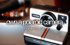 an old polaroid camera with the words own a polaroid camera on it's side