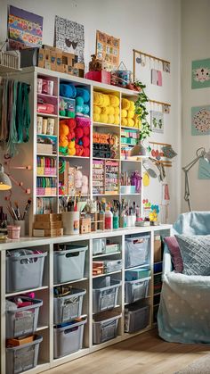 a room filled with lots of crafting supplies and storage bins on the wall