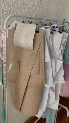 several pieces of paper are hanging on a rack