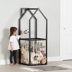 A storage unit for the playroom! Our playhouse storage tower is designed to fit in with the childlike decor of your room, but also to create a practical organizational space. Inside, you can store stuffed animals, dolls, large balls, and larger toys. Several wooden bars have been added all around to keep all your little one's toys in place. Another plus is that your children will be able to put away their own accessories once playtime is over. It's not just mom and dad who can put things away! A Scandinavian playroom tower playroom decor is often colorful, cheerful, and fun. We love its small house shape, its triangular roof, and its little chimney. This storage tower is made of real wood, which makes it very strong and safe. It was also entirely designed according to the current safety st Scandinavian Playroom, Store Stuffed Animals, Toy Storage Units, Boys Playroom, Toddler Playroom, Kids Playroom Decor, Toy Organizer, Storage Tower, Playroom Organization