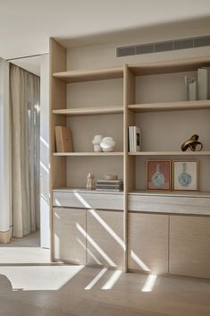 an open bookcase in the corner of a room