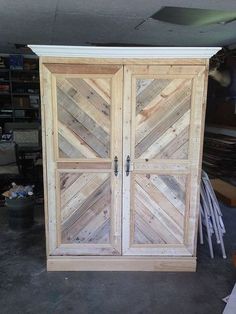 a wooden cabinet with two doors made out of wood planks