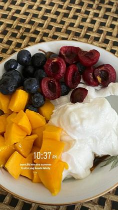 fruit and yogurt are arranged on a plate