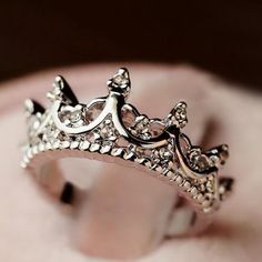 a close up of a ring with a crown on it