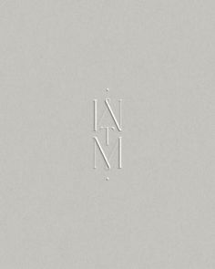 the letter n is made up of white letters on a light gray background, and it appears to be written in cursive writing