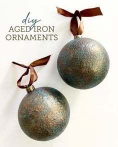 two metal ornaments with ribbons on them and the words diy agedron ornaments written below