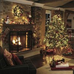 a living room filled with furniture and a christmas tree in front of a fire place