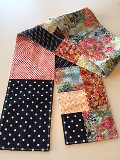 four different pieces of fabric laid out on top of each other with polka dots and flowers