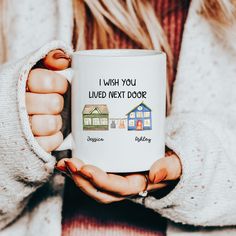 a woman is holding a coffee mug in her hands that says i wish you lived next door