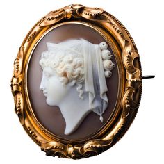 Welcome to Artisan Antiques based in Mayfair, London - We are delighted to offer this magnificent large antique 18ct gold shell cameo brooch/pendant locket made c.1860, depicting a figurehead of Hera - a Greek mythological goddess of women, marriage and childbirth (also referred to as Juno by the Romans). Its majestic presence, distinguished design and impressive size are immediately captivating even to the untrained eye and whilst undeniably attractive and delightful even at a quick glance, it Vintage Cameo Brooch, Women Marriage, Locket Design, Pendant Locket, Mayfair London, Velvet Interiors, Vintage Cameo, Cameo Brooch, Gold Ribbons