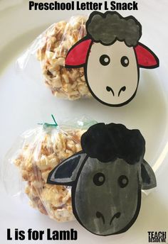 two sheep shaped treats on a plate with the words preschool letter l snack