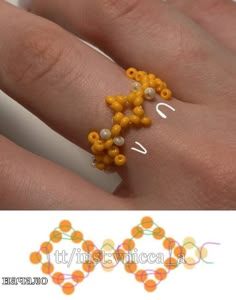 a woman's hand with an orange beaded ring on it and the words love spelled in white letters