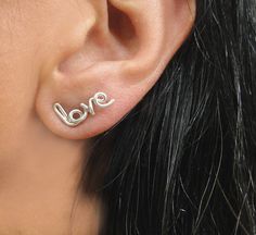 "Love Stud Earrings in Silver, Stuffing Stuffer, Word Earrings, Personalized Earrings, Silver Love Earrings, Custom Name Earrings, Heart Stud Earrings, Christmas Gift The dainty \"love\" word and \"heart symbol\" are super adorable for all-day, everyday wear. Each earring is hand-crafted, hammered, and hand polish for a brilliant shine. The Heart is approximately 5 mm long \"Love\" is 10 mm long ♥As a jewelry designer, and committed to my faith, I reserve the right to NOT create any words with ( Cute Nickel Free Earrings For Anniversary, Cute Nickel-free Earrings For Anniversary, Cute Hypoallergenic Earrings For Anniversary, Cute Dangle Earrings For Anniversary, Earrings Word, Personalized Earrings, Word Earrings, Love Word, Name Earrings