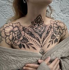 a woman with a tattoo on her chest